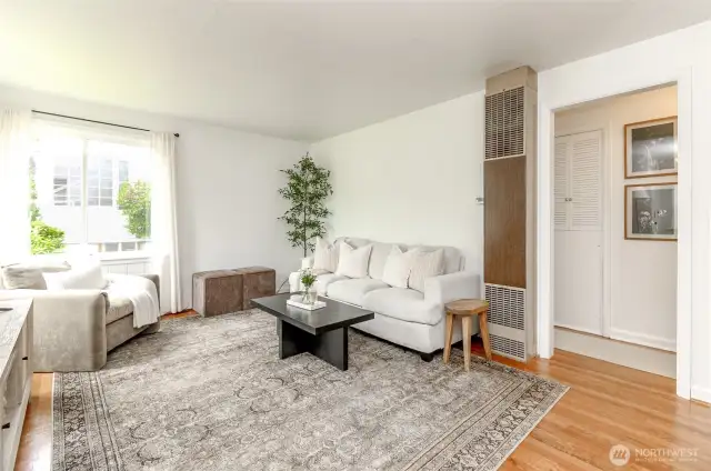 Living room featuring natural light and hardwood flooring