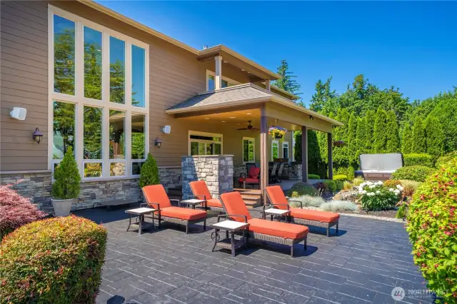 Back of home has stone accents - deck off primary bedroom above.