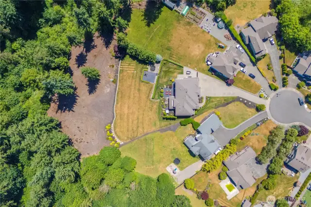 Another aerial view of the subject property. Potential RV/boat parking behind the gate on the south side of the house.