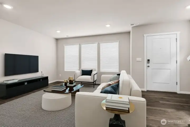 Sun-lit living room at front of home offers flexible furniture placement and welcoming front-door views. Pictures are for representational purposes only, colors and features may vary.