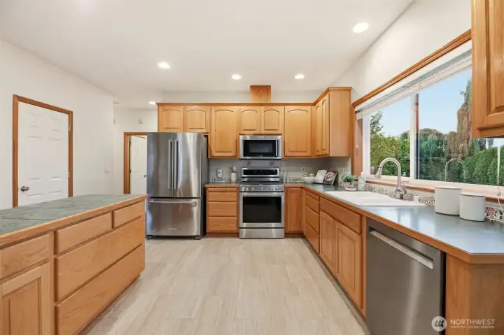 Kitchen w/ stainless steel appliances.