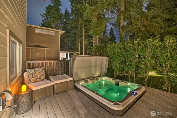 Backyard deck including hot tub