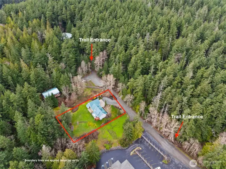Aerial perspective showing how close the home sits to multiple forest land access points, offering immediate connection to the trail system.