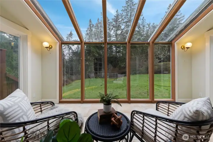 Perfect for enjoying quiet moments while watching deer and other wildlife pass through the backyard, or taking advantage of the beautiful natural light to read and relax.