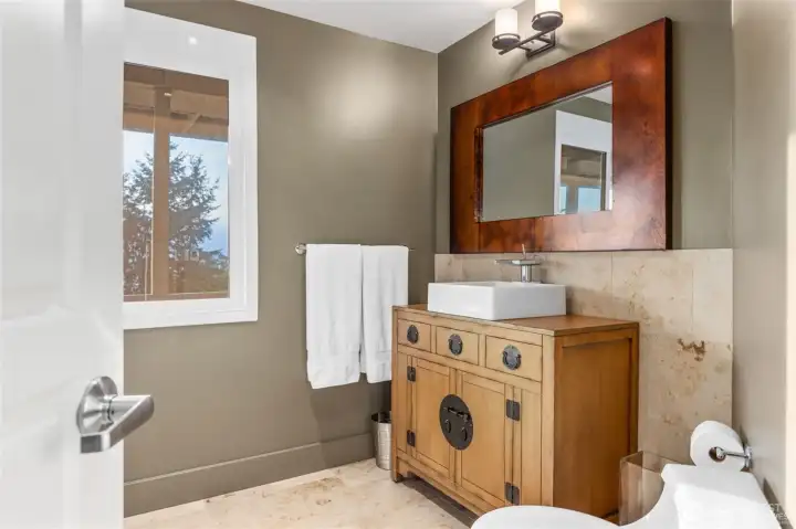 Guest bedroom with heated floors and scenic views.