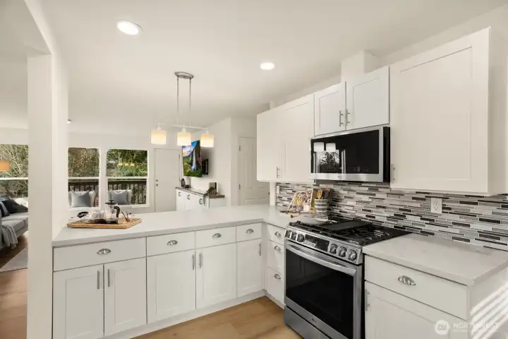 The kitchen is open to the living room and dining room.