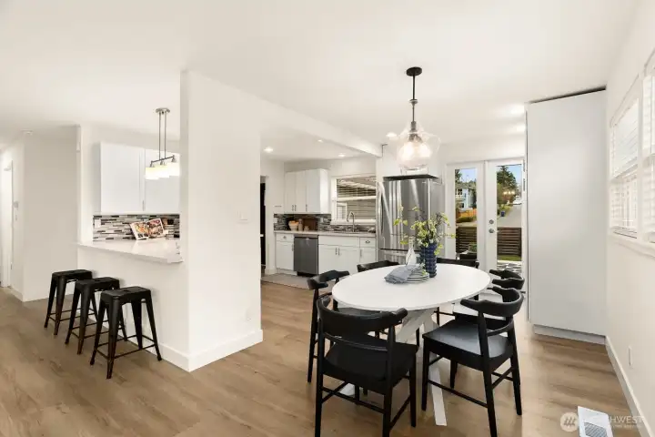 There's plenty of space for a large dining table and more seating on the kitchen peninsula.