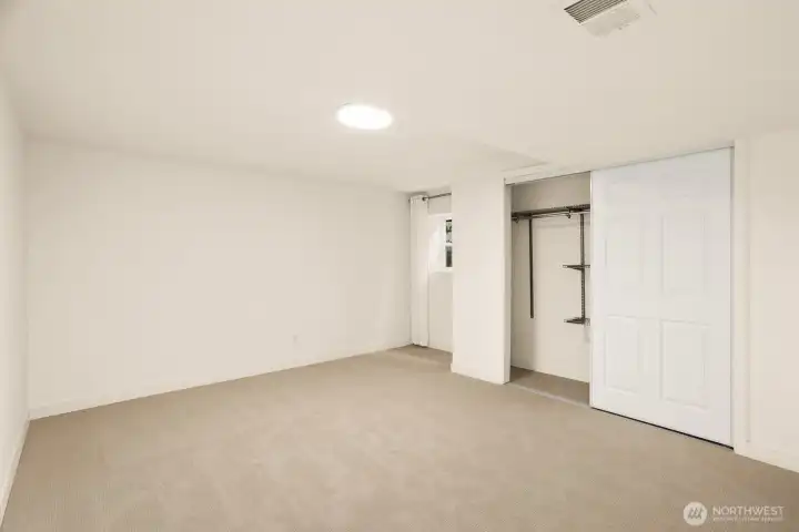 This is the 5th bedroom; it's also on the lower level. It's the largest bedroom in the house and could be used for an office, home gym, playroom, etc.