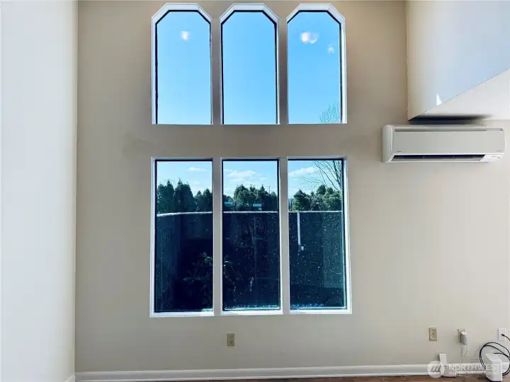 Vaulted ceilings and natural light floods this spacious one level condo