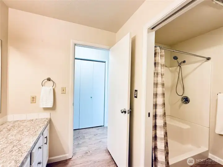 Walk-in shower just through the pocket door