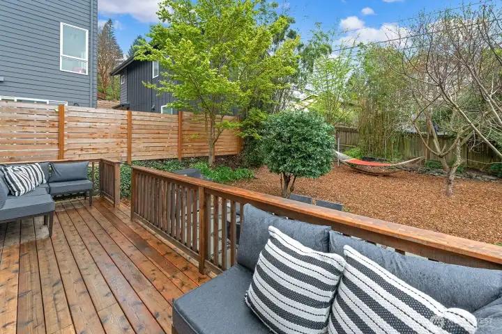 A spacious deck.    and rear yard.