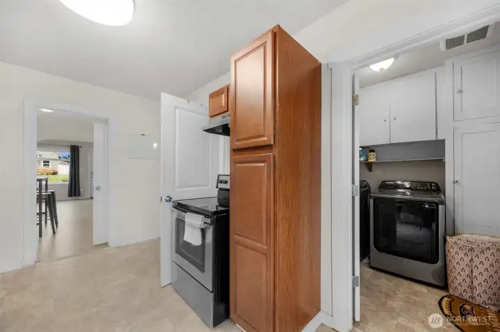Laundry room off kitchen with back patio access