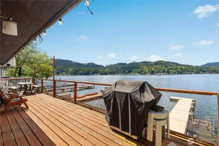 Relax, BBQ, and entertain on the view deck with the dock and water right below. Relax, BBQ, and entertain on the view deck with the dock and water right below.