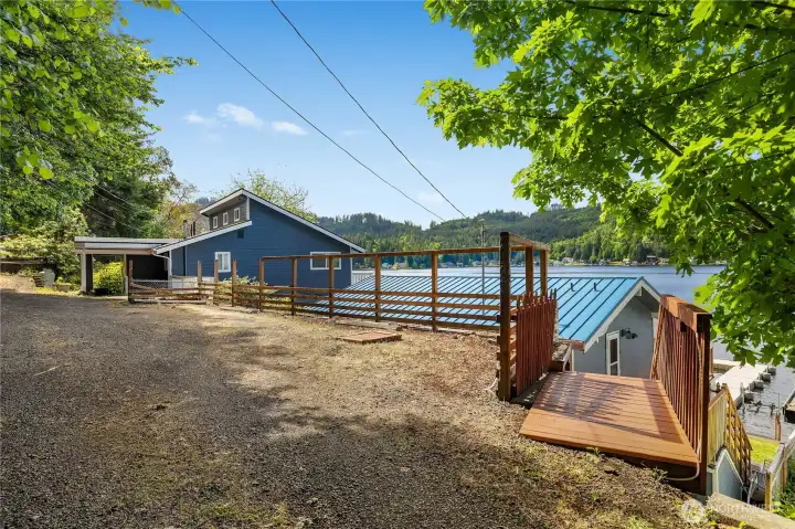 Elevated approach with lake views, parking area, deck access, and a setting designed around Summit Lake living. Elevated approach with lake views, parking area, deck access, and a setting designed around Summit Lake living.
