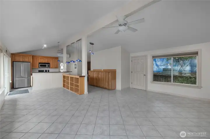 Arrange the space for dining, lounging, or entertaining with easy flow to the kitchen and deck. Arrange the space for dining, lounging, or entertaining with easy flow to the kitchen and deck.