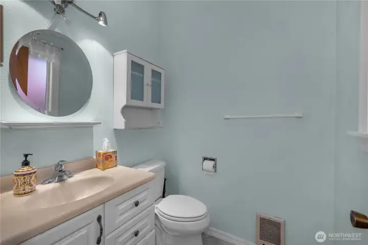 Keep guests comfortable with an easily accessible powder room near the main living space. Keep guests comfortable with an easily accessible powder room near the main living space.