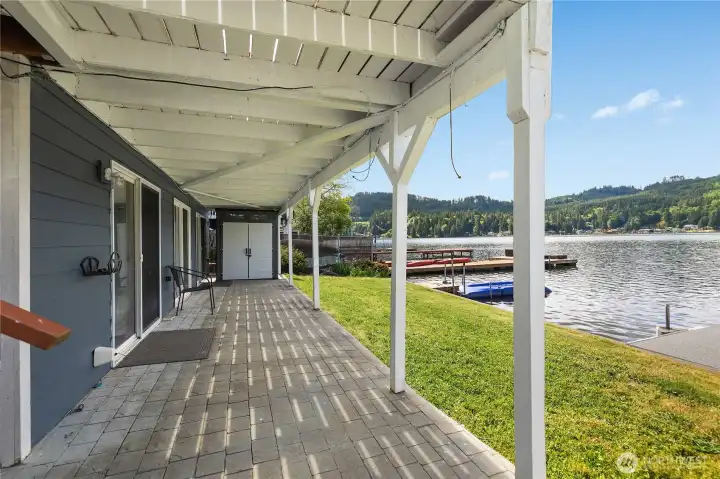 Covered lower patio accessed fr both BRs, lawn, and waterfront access create flexible outdoor living near the lake. Covered lower patio accessed fr both BRs, lawn, and waterfront access create flexible outdoor living near the lake.