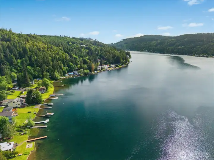 Aerial lake view shows the long shoreline, surrounding hills, and sparkling Summit Lake waters. Aerial lake view shows the long shoreline, surrounding hills, and sparkling Summit Lake waters.