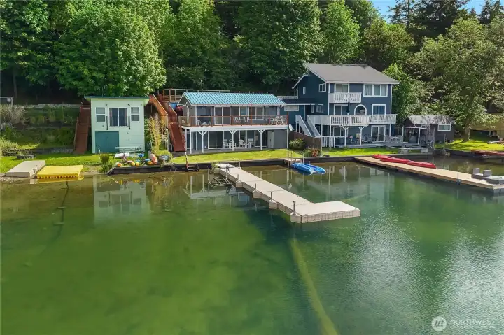 Come home to a ready-made lakefront playground with dock, deck, lawn, and clear water. Come home to a ready-made lakefront playground with dock, deck, lawn, and clear water.