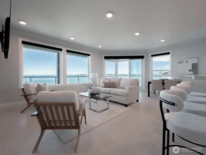 Walls of windows and an open layout create a bright, airy atmosphere with uninterrupted views extending across Commencement Bay to NE Tacoma and the Islands. Walls of windows and an open layout create a bright, airy atmosphere with uninterrupted views extending across Commencement Bay to NE Tacoma and the Islands.