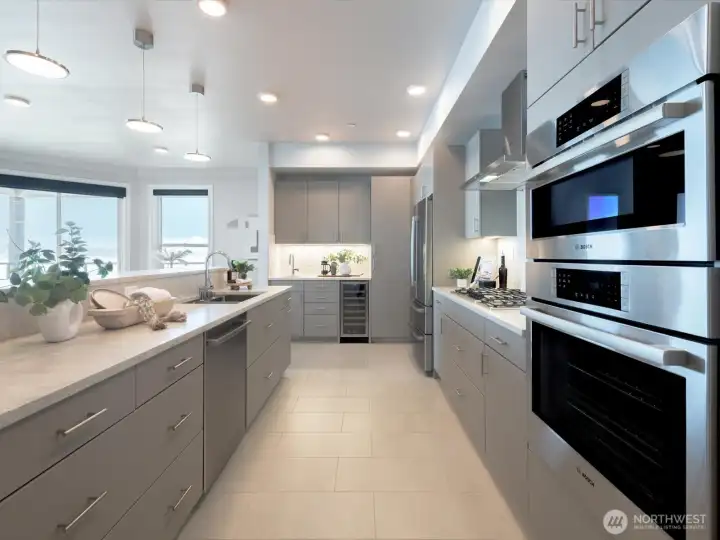The chef's kitchen showcases premium stainless appliances, quartz surfaces, abundant cabinetry, and thoughtful design details. The sellers designed the kitchen in mind for efficiency with unique cabinetry and custom countertops with full height backsplash. The chef's kitchen showcases premium stainless appliances, quartz surfaces, abundant cabinetry, and thoughtful design details. The sellers designed the kitchen in mind for efficiency with unique cabinetry and custom countertops with full height backsplash.