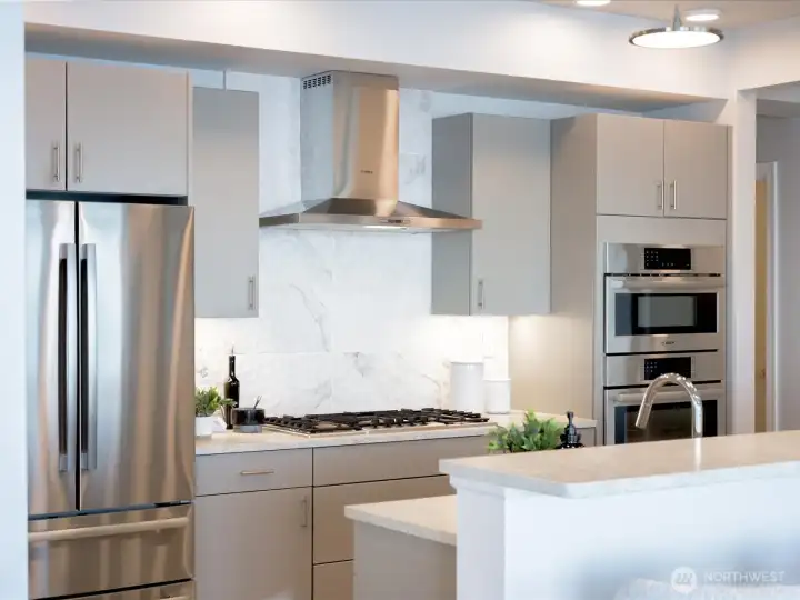 You'll appreciate the full height tile backsplash behind the gas cooktop You'll appreciate the full height tile backsplash behind the gas cooktop