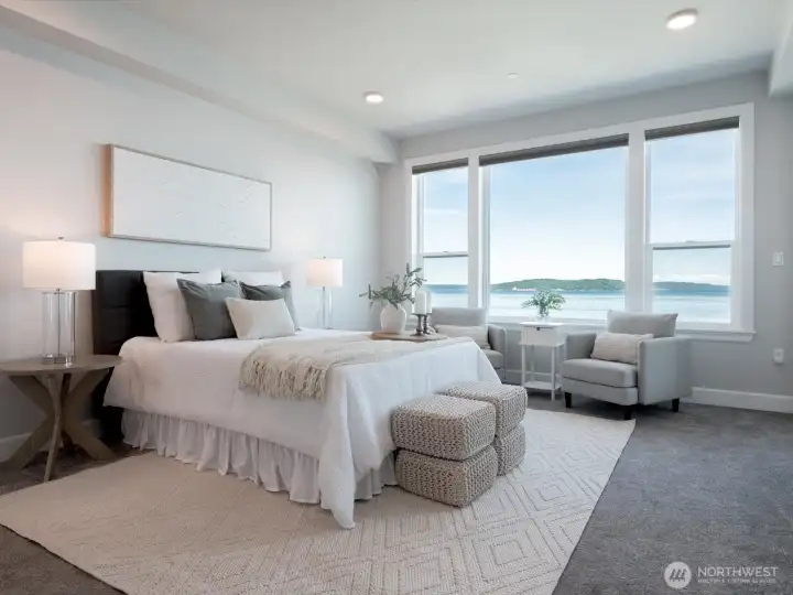 Expansive windows fill the primary retreat with natural light while framing remarkable views of Commencement Bay. Electronic blinds (throughout) will minimize the brightness if you'd prefer Expansive windows fill the primary retreat with natural light while framing remarkable views of Commencement Bay. Electronic blinds (throughout) will minimize the brightness if you'd prefer