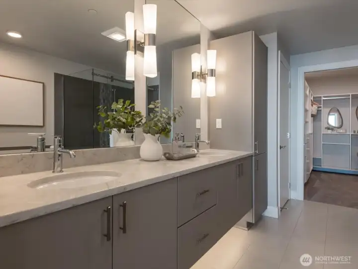 Dual undermount vanities with generous storage create a luxurious and functional space for daily routines. The floors are heated here in the primary bath and the undermount light creates a great nightlight. Dual undermount vanities with generous storage create a luxurious and functional space for daily routines. The floors are heated here in the primary bath and the undermount light creates a great nightlight.