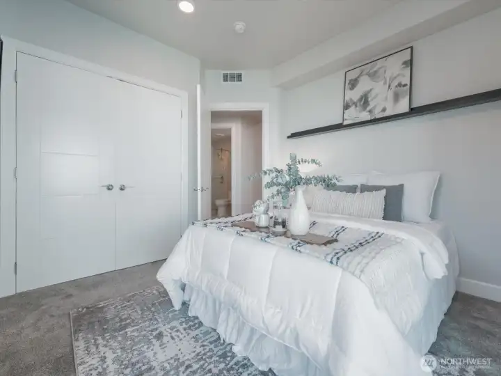Located down the hall from the entry and just across from the main bath for the ease of your guests, this room is on the other side of the condo from the primary bedroom. Located down the hall from the entry and just across from the main bath for the ease of your guests, this room is on the other side of the condo from the primary bedroom.