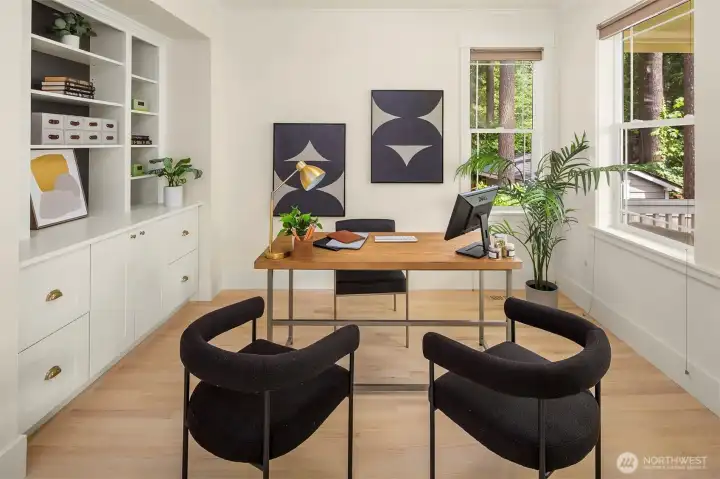 Spacious office with built-in cabinets and shelves. Spacious office with built-in cabinets and shelves.