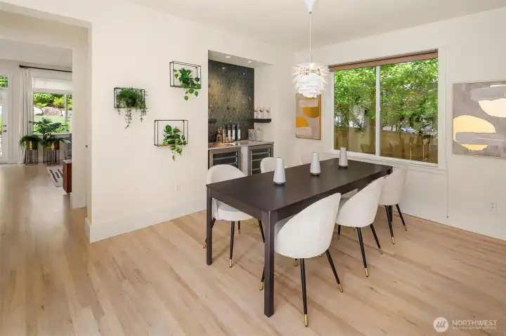Dining room with wine/drink bar with two wine fridges. Dining room with wine/drink bar with two wine fridges.