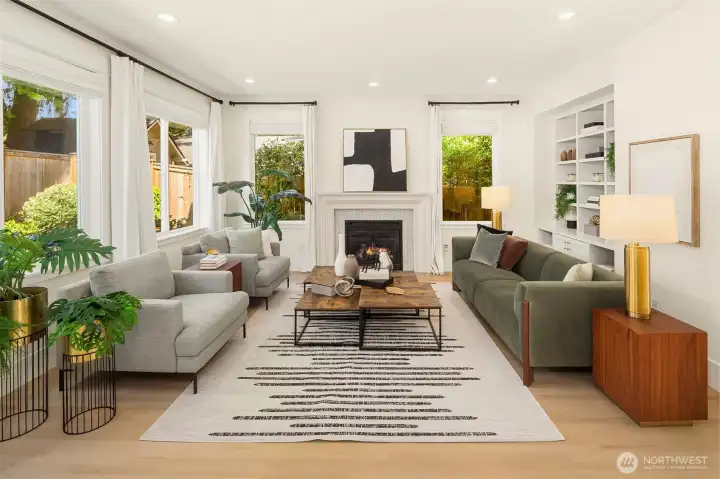 Living room with gas fireplace, built-in shelves and remote controlled blinds. Living room with gas fireplace, built-in shelves and remote controlled blinds.