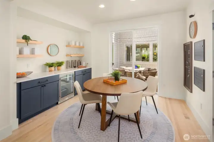Dining nook off kitchen with coffee/beverage bar with beverage and additional cabinets for additional storage. Dining nook off kitchen with coffee/beverage bar with beverage and additional cabinets for additional storage.