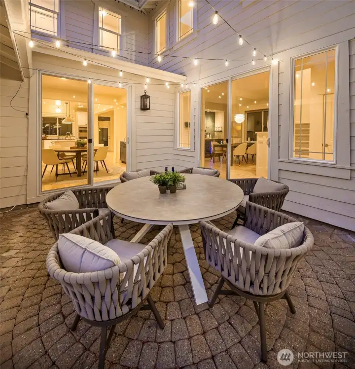 Outdoor courtyard is perfect for dining al fresco on those summer evenings and a great part of entertaining since there are two doors to the interior from this space. Outdoor courtyard is perfect for dining al fresco on those summer evenings and a great part of entertaining since there are two doors to the interior from this space.
