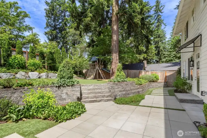 Fantastic patio with patio space, artificial turf and play set. Fantastic patio with patio space, artificial turf and play set.