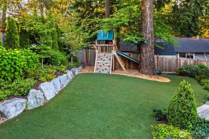 Spacious backyard is landscaped beautifully and always looks good with the artificial turf without the hassle of having to mow it. Spacious backyard is landscaped beautifully and always looks good with the artificial turf without the hassle of having to mow it.