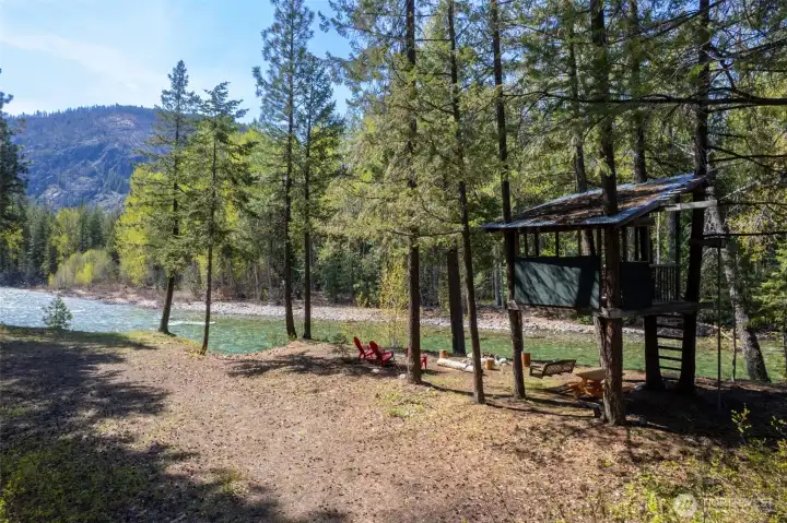 Riverside treehouse overlooking the Methow River—headquarters for adventure, campfires, river floats, and making lifelong family memories. Riverside treehouse overlooking the Methow River—headquarters for adventure, campfires, river floats, and making lifelong family memories.