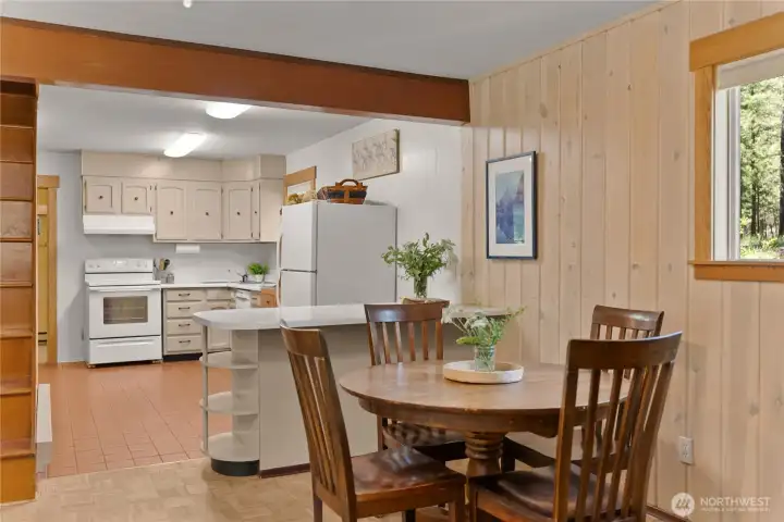 Open dining and living spaces create a warm and inviting gathering place. Open dining and living spaces create a warm and inviting gathering place.