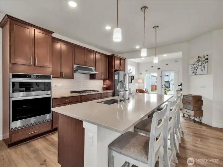 Open-concept kitchen with breakfast bar.