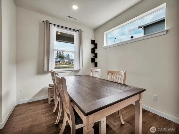Formal dining area. 8-person table fits.