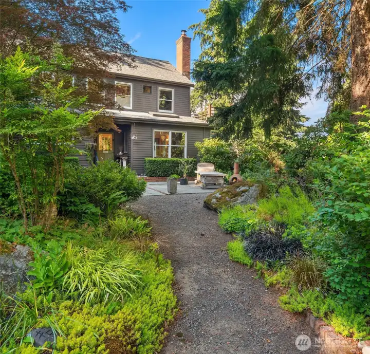 Follow the garden path through a storybook setting and discover a home filled with character, warmth, and unexpected delights.