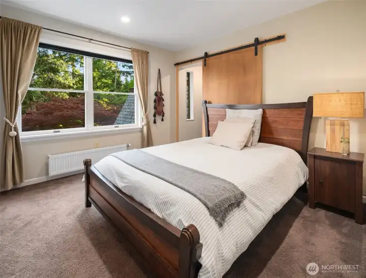 Charming and comfortable, this upstairs bedroom offers flexibility for guests, work, or hobbies.