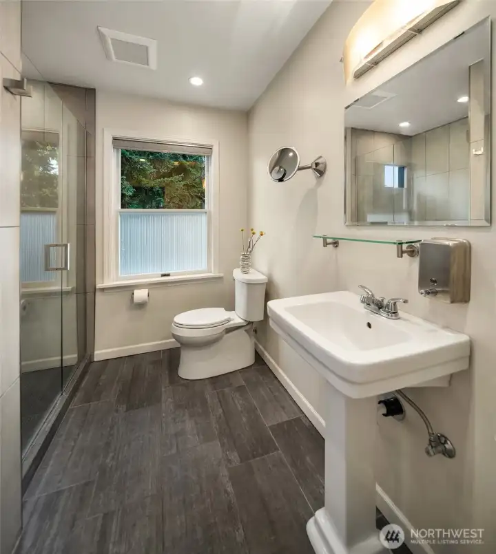 Thoughtfully updated with heated floors and modern fixtures, the primary bath offers everyday comfort with a touch of luxury.