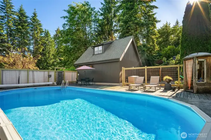 Solar-heated and privately positioned, the pool creates a resort-inspired setting for summer gatherings and everyday enjoyment.