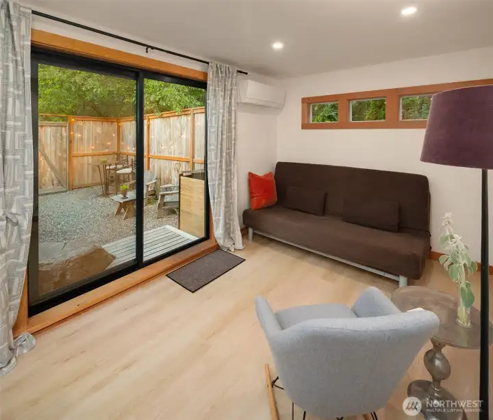 Flexible living area with mini-split heating and cooling, perfect for guests, remote work, or creative use.