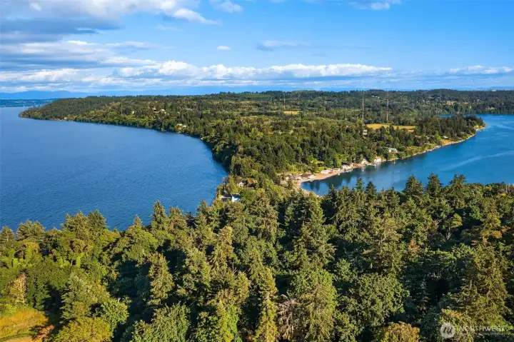 Positioned near the shores of Tramp Harbor and Quartermaster Harbor, the property enjoys a setting that captures the natural beauty of Vashon Island.