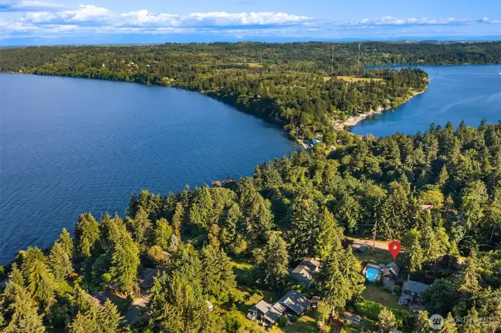 Positioned near the shores of Tramp Harbor and Quartermaster Harbor, the property enjoys a setting that captures the natural beauty of Vashon Island.