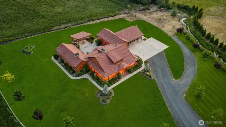 Manicured yard with mature landscaping