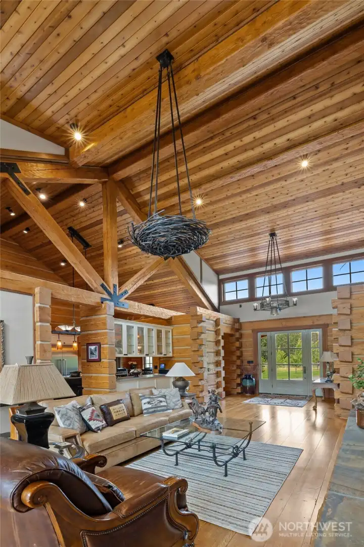 Custom metal lighting fixtures and towering timber frame trusses