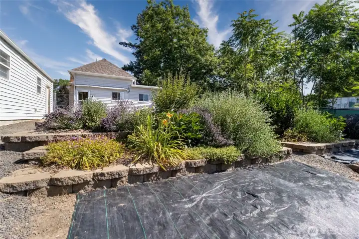 multiple garden beds in the gently sloped back yard multiple garden beds in the gently sloped back yard